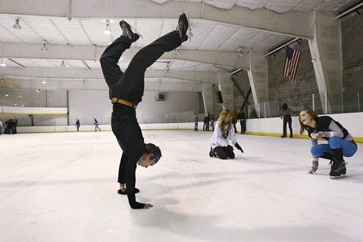 	Dustin Gabrich, left, does a hand stand while his sisters Holly, middle, and Krista skate at the


