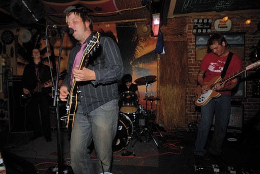 Members of the Mindy Set, from left, Josh Williams, Matt Dickens, Jill McArthur and Dan Previtt, perform Saturday at Burt's Tiki Lounge. 