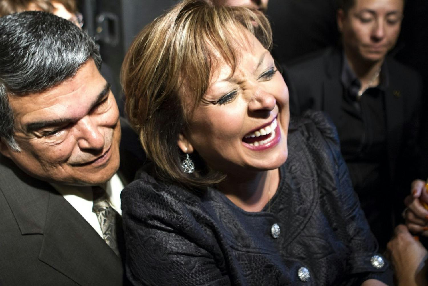 New Mexico governor Susana Martinez, center, greets supporters after her victory speech at the Albuquerque Marriott on Tuesday night. Martinez, a Republican, won re-election after defeating Democrat Gary King.