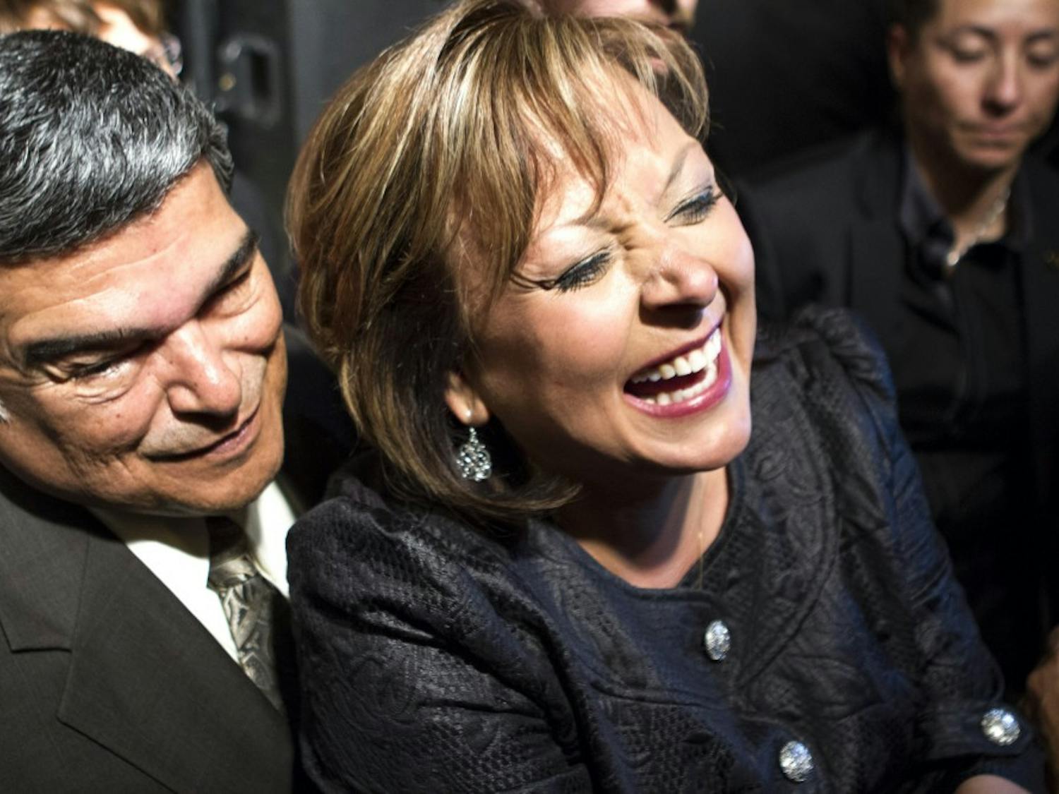 New Mexico governor Susana Martinez, center, greets supporters after her victory speech at the Albuquerque Marriott on Tuesday night. Martinez, a Republican, won re-election after defeating Democrat Gary King.