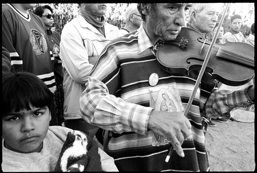 A violinist plays during a Matachines celebration for Our Lady of Guadlupe in the Village of Tortugas in Las Cruces in 1996.