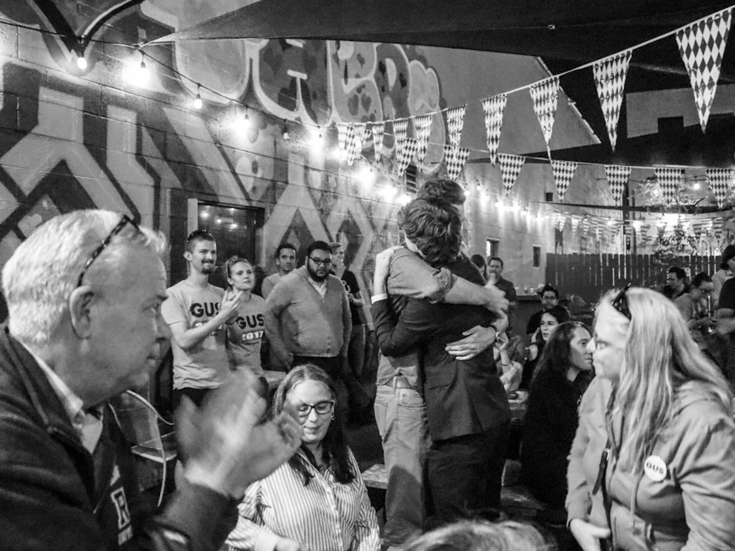 Mayoral candidate Gus Pedrotty embraces a supporter during his viewing party on Oct. 03, 2017. Gus will be running against the other candidates in November's 14 election after Tuesday nights runoff results.