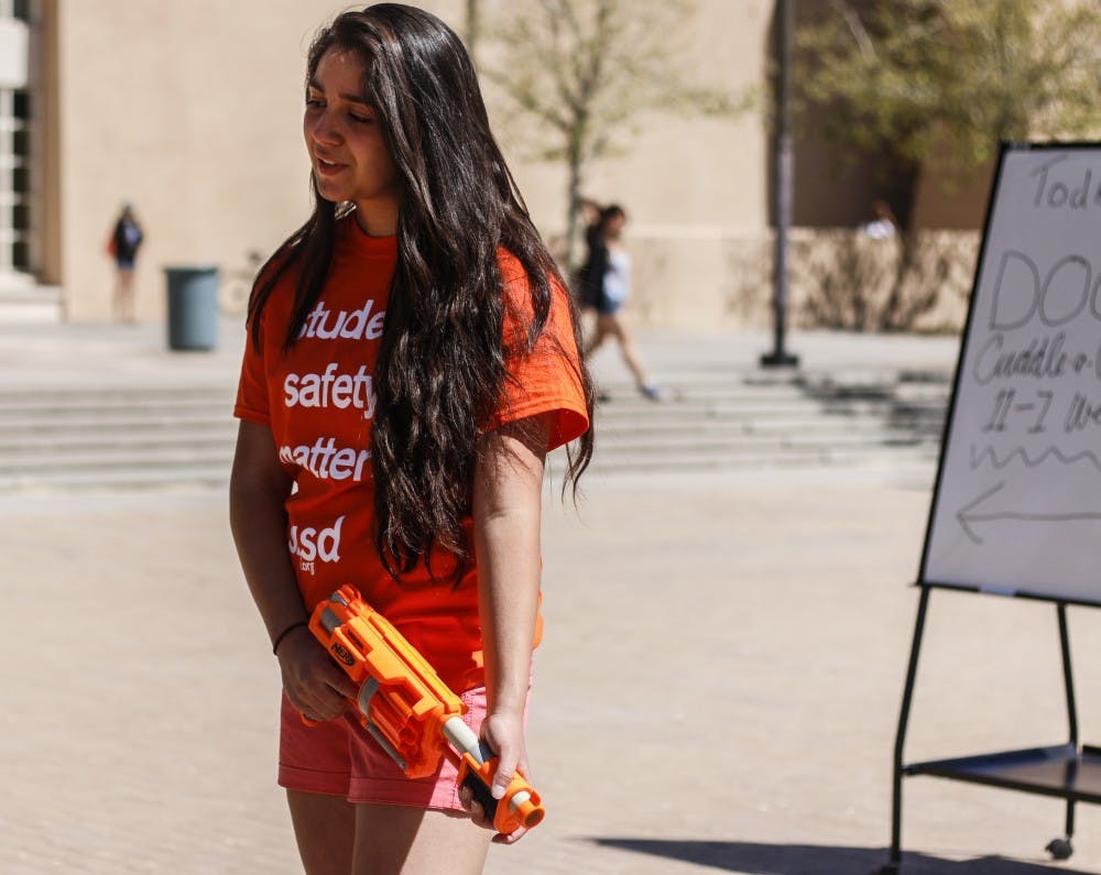 Marina Herrera asks students to support their petition for students to be able to carry stun guns on campus Wednesday afternoon. The organization, Students for Self-Defense, was formed, in part, after ASUNM rejected a pro-stun gun resolution in February. 