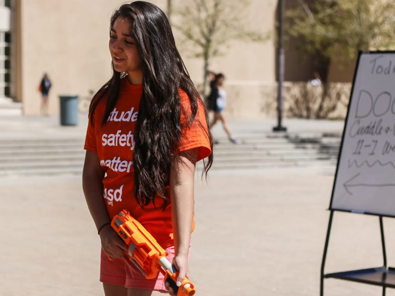 Marina Herrera asks students to support their petition for students to be able to carry stun guns on campus Wednesday afternoon. The organization, Students for Self-Defense, was formed, in part, after ASUNM rejected a pro-stun gun resolution in February.