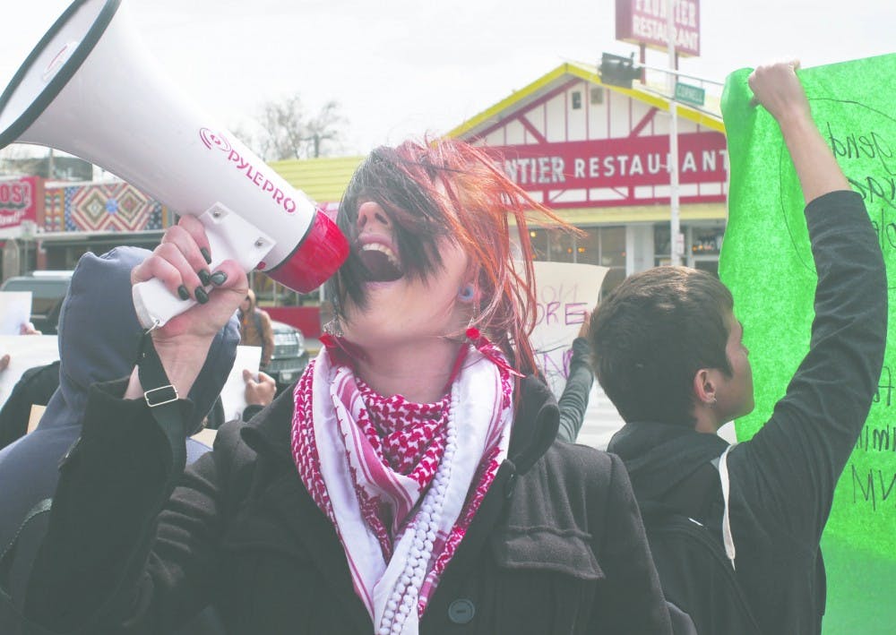 Brittany Arneson protests alongside members of Raza Graduate Student Association as part of a march around campus. Arenson is currently facing disorderly conduct charges with UNM stemming from a Feb 23 incedent. 