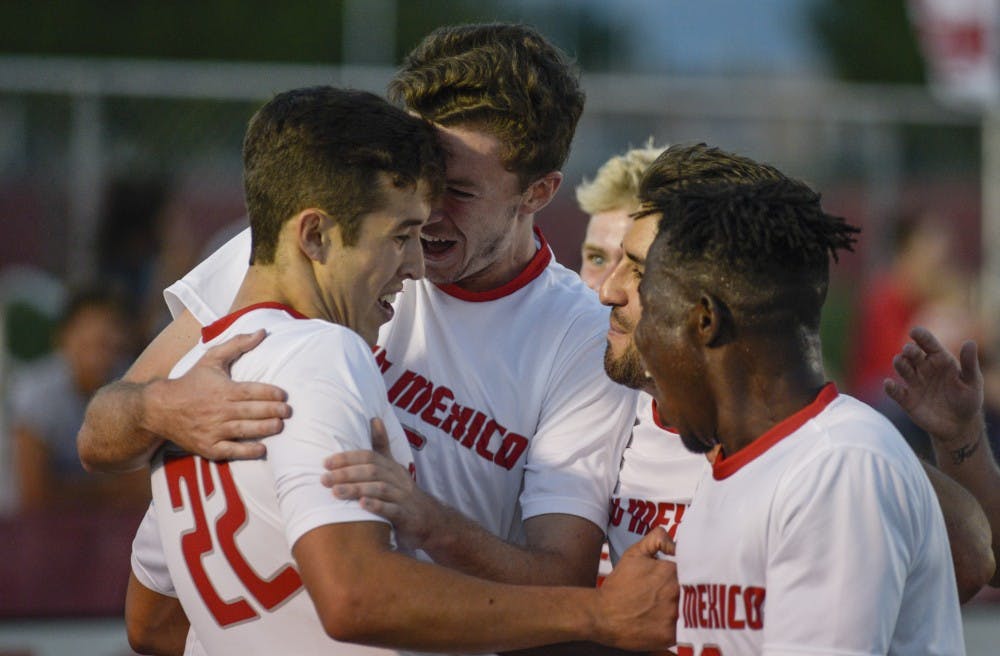 Matt Dorsey embraces Aaron Herrera &nbsp;after Herrera scored the tie breaking goal to solidify the Lobos victory over UC Irvine during the Grange and Ashwill Invitational at UNM, Sunday, Sept. 10, 2017.
