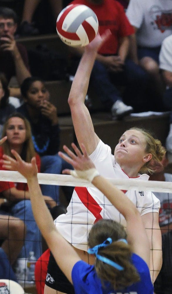 	Ashley Rhoades leaps to spike the ball in this file photo. Rhoades was honored as one of two Mountain West Conference Players of the Week.