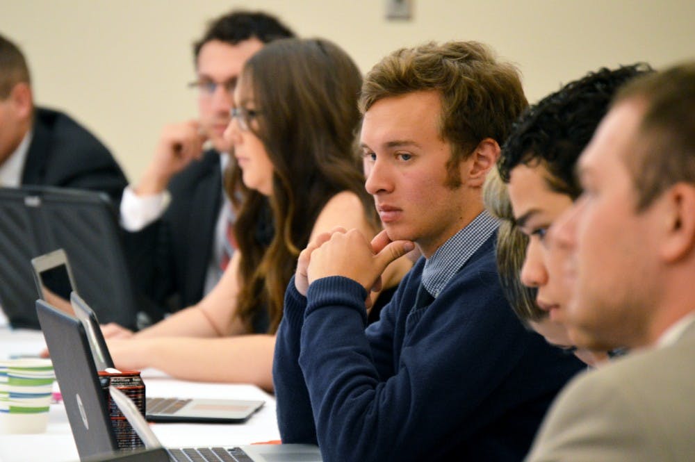 ASUNM senator Erick Musick listens to proposals and takes notes on his laptop in the SUB Wednesday night. This was Musicks first full meeting after being sworn in as a replacement senator. 