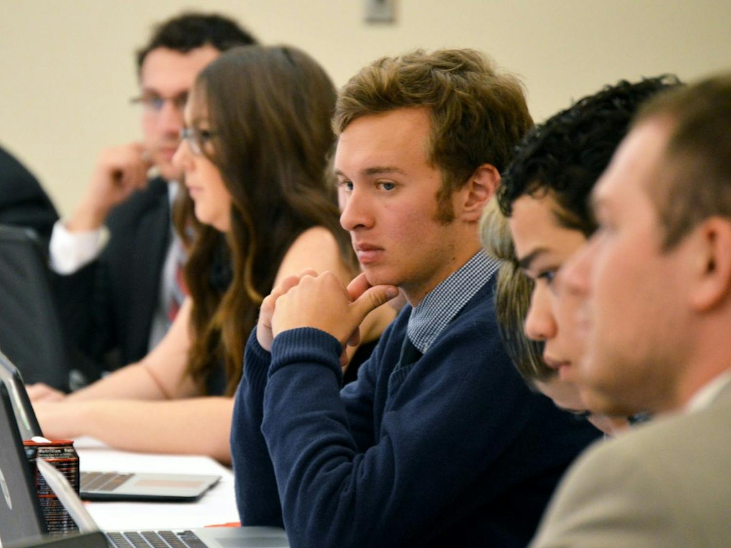 ASUNM senator Erick Musick listens to proposals and takes notes on his laptop in the SUB Wednesday night. This was Musicks first full meeting after being sworn in as a replacement senator. 