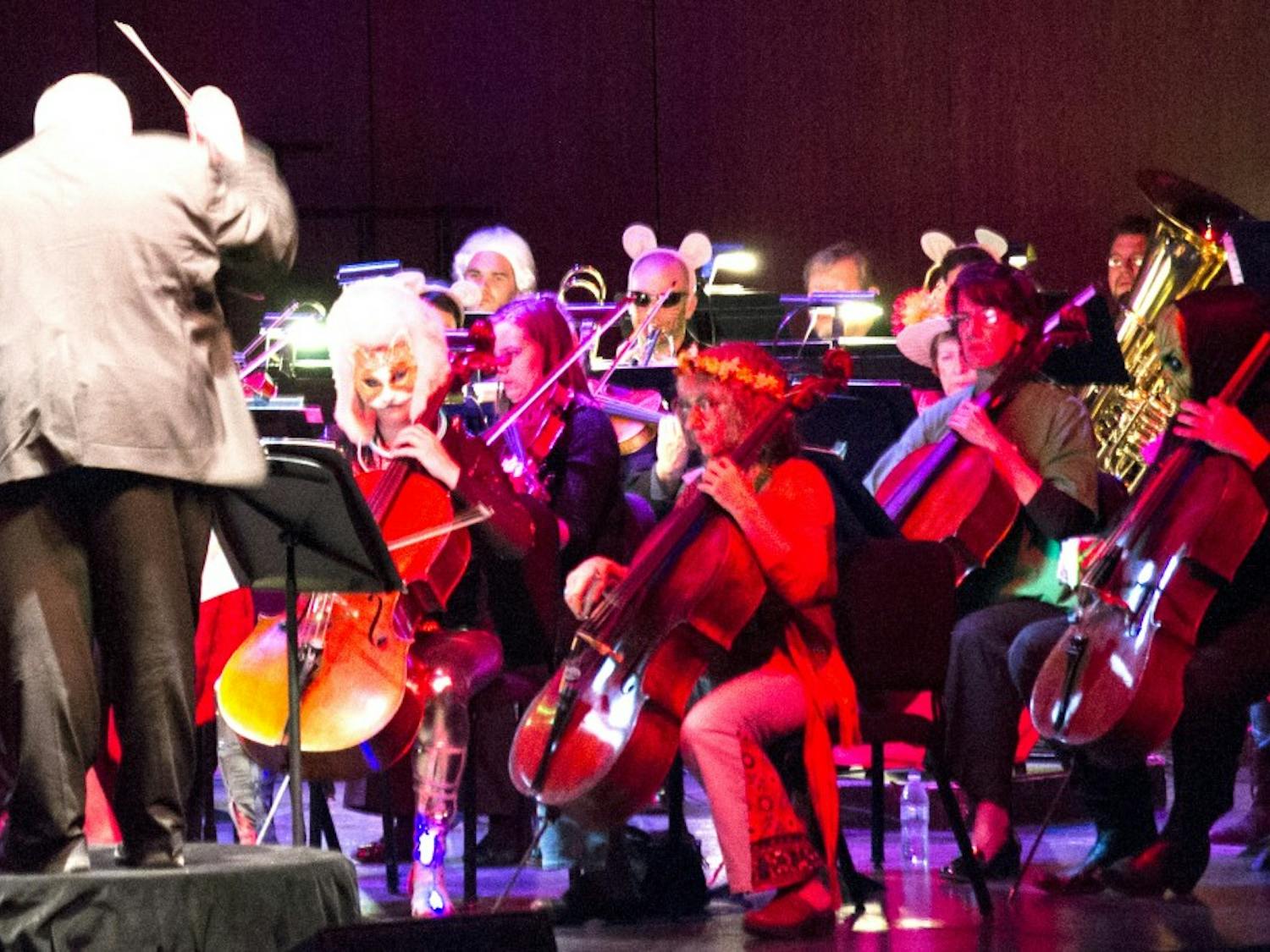 Byron Herrington conducts the New Mexico Philharmonic during Breaking Boo on Saturday evening at Popejoy Hall. The orchestra played Halloween-themed music wearing Halloween costumes throughout the event.