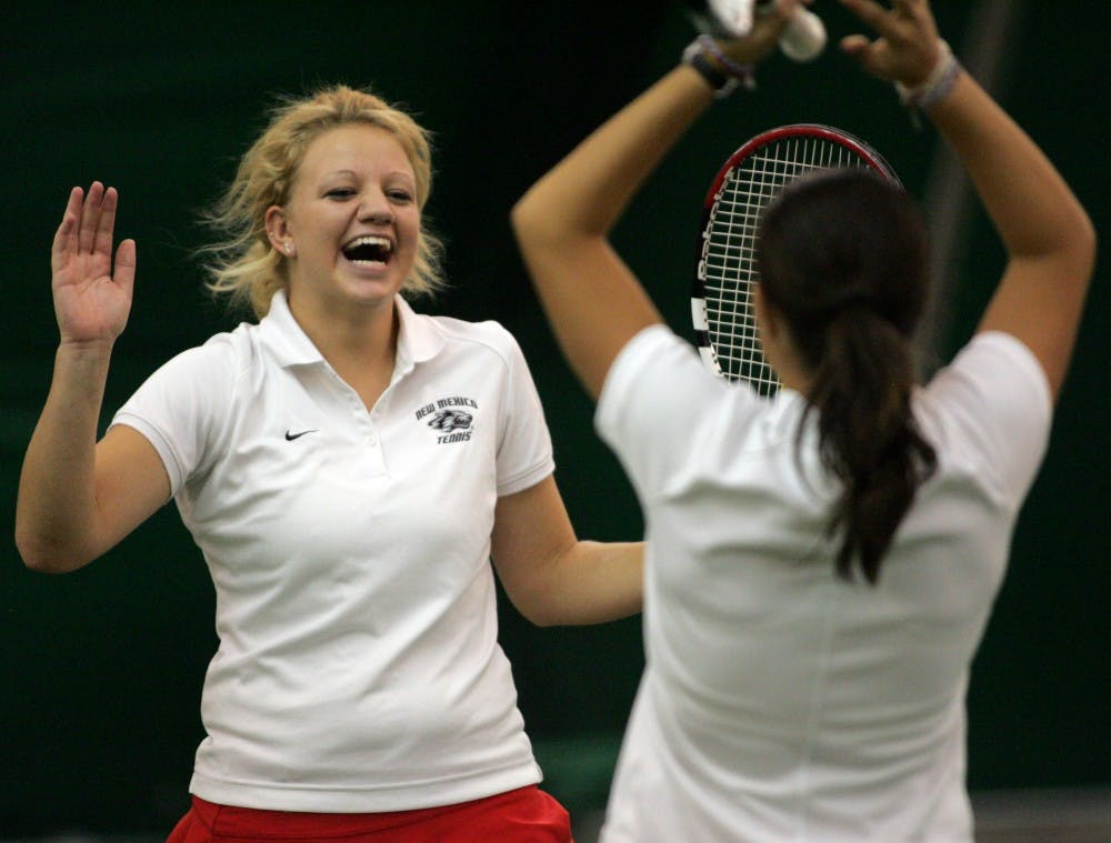 Ashley Bonner, left, and Anya Villanueva-Forte celebrate after a 9-7 win in a doubles match against Monterrey Tech on Wednesday at the UNM Tennis Complex. 