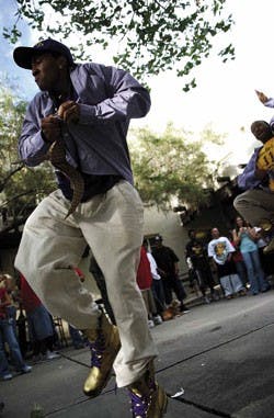 Omega Psi Phi member Trey Pickett dances during a welcome-back barbeque hosted by African-American Student Services on Thursday next to Mesa Vista Hall. The event provided the opportunity for new and returning students to meet people from different Africa