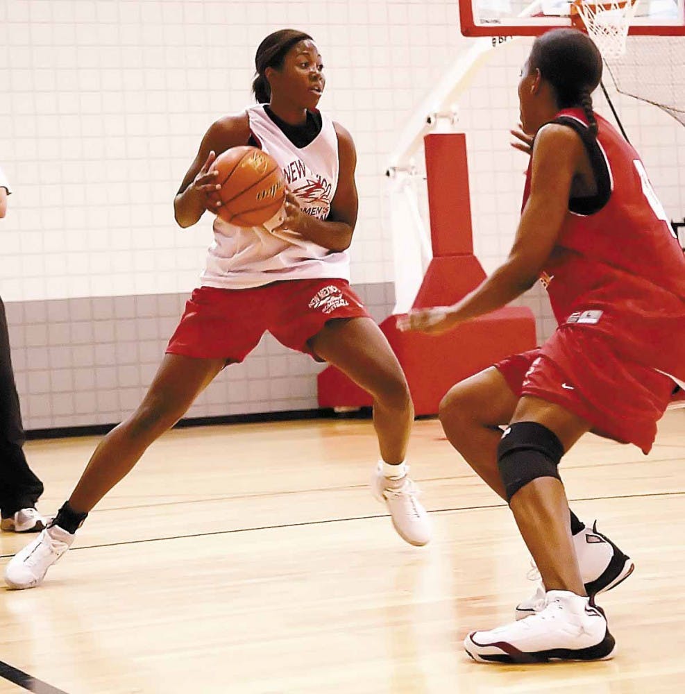 Lobo guard Brandi Kimble, right, defends forward Christian Shelter during a practice at the Rudy Davalos Basketball Center on Wednesday.
