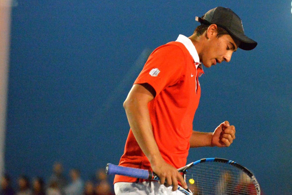 Sophomore Jorge Escutia reacts after winning a point against Utah Friday evening at the McKinnon Famiy Tennis Center. The Lobos upset the No. 53 Utes after beating DePaul earlier in the day. 