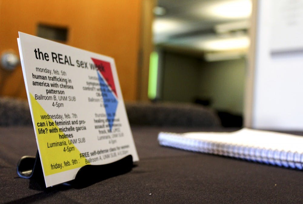 A schedule of the events happening throughout the Real Sex Week and a sign-in sheet sit outside the Luminara room in the SUB just before a talk on healing after sexual assault begins on Feb. 8, 2018.