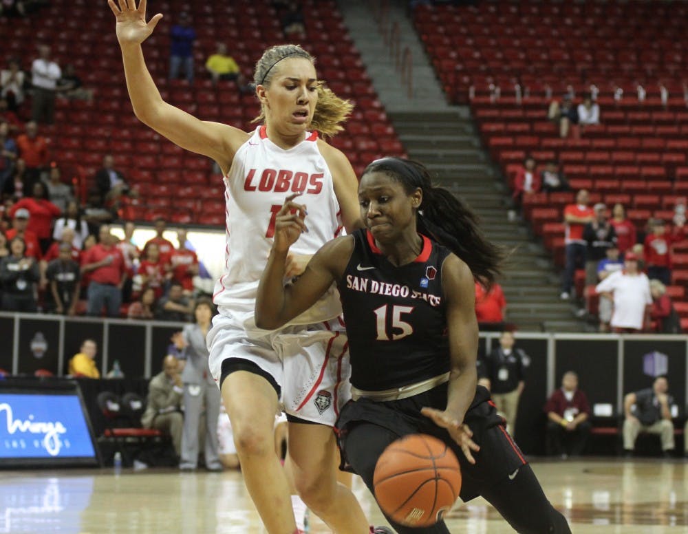 UNM's Alexa Chavez guards San Diego State's McKynzie Fort during the second half of the Mountain West Basketball Tournament quarterfinal game Tuesday evening at the Thomas &amp; Mack Center in Las Vegas. The Lobos held off the Aztec to advance to Wednesday's semifinals.