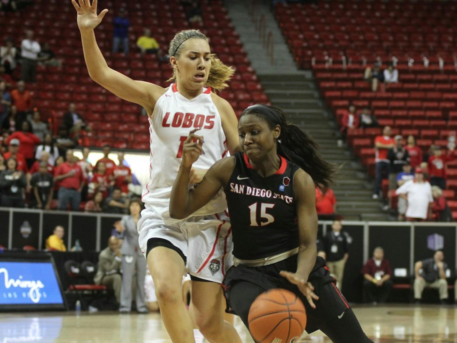 UNM's Alexa Chavez guards San Diego State's McKynzie Fort during the second half of the Mountain West Basketball Tournament quarterfinal game Tuesday evening at the Thomas &amp; Mack Center in Las Vegas. The Lobos held off the Aztec to advance to Wednesday's semifinals.