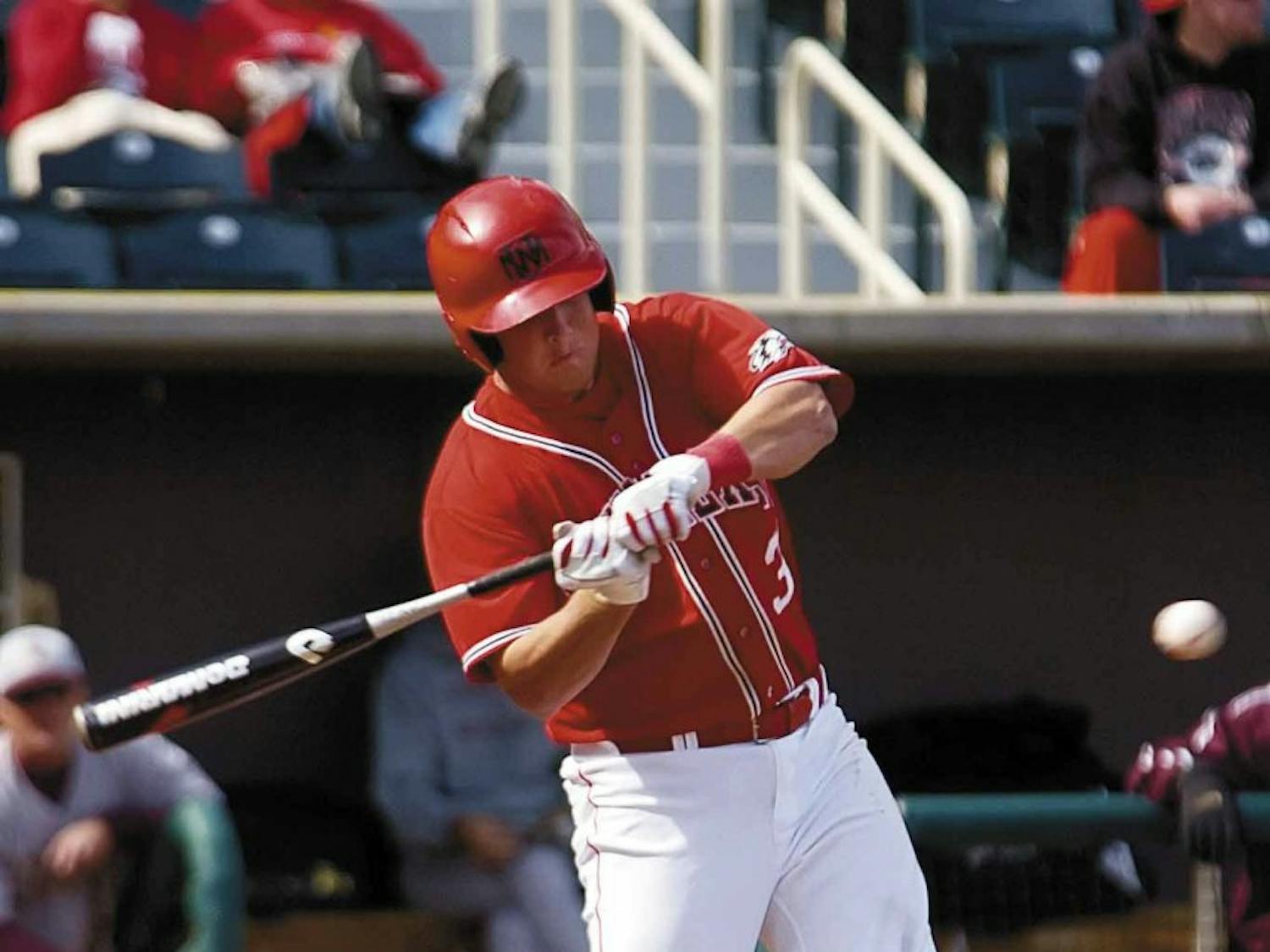 Outfielder Jay Russell swings at a ball thrown by Texas State pitcher Justin Fiske during Sunday's game at Isotopes Park. The Lobos lost to Texas State 11-4.