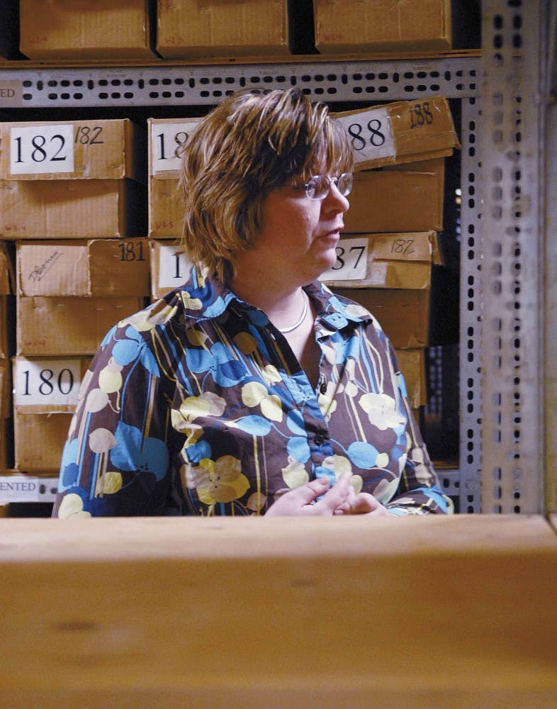 Curator Heather Edgar stands in the room where donated human skeletons are stored in archival boxes for Maxwell Museum's Laboratory of Human Osteology. The lab stores about 250 modern skeletons and is also home to historic and prehistoric remains from abo