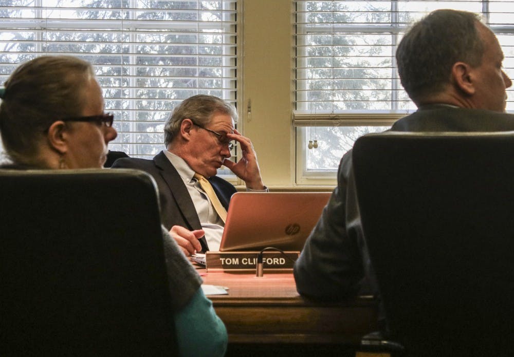 UNM Regent Tom Clifford scratches his head during a HSC Committee meeting on&nbsp;Tuesday, Feb. 7, 2017 at Scholes Hall.