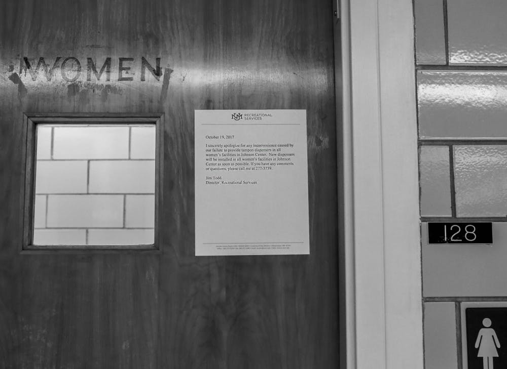 A sign apologizing for the lack of tampon dispensers is displayed outside a women?s restroom at Johnson Gym on Oct. 20, 2017. 
