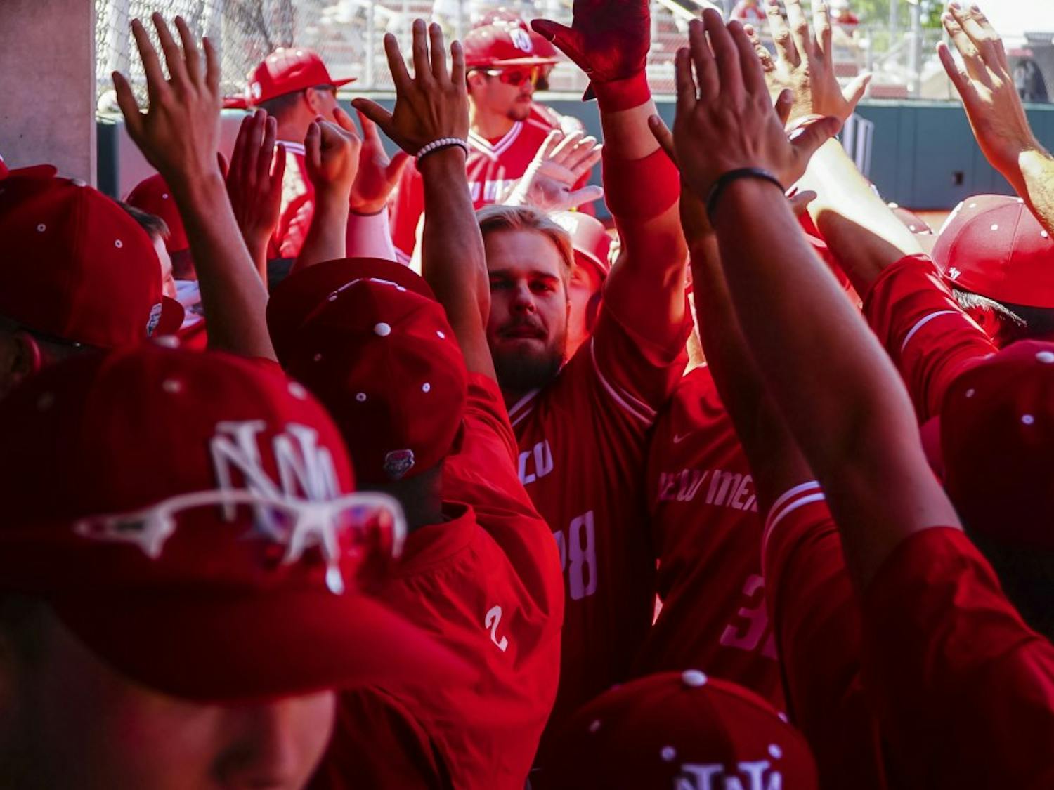 Jack Zoellner congradulated by the dugout after hitting a 3-run homerun against UNLV on Saturday 4/21.