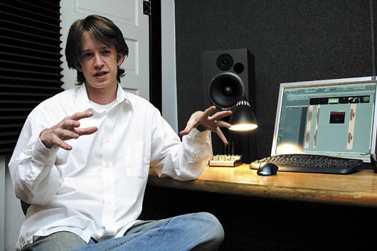 Student Mark Oates talks Saturday about how he uses his home studio to compose scores for movies.