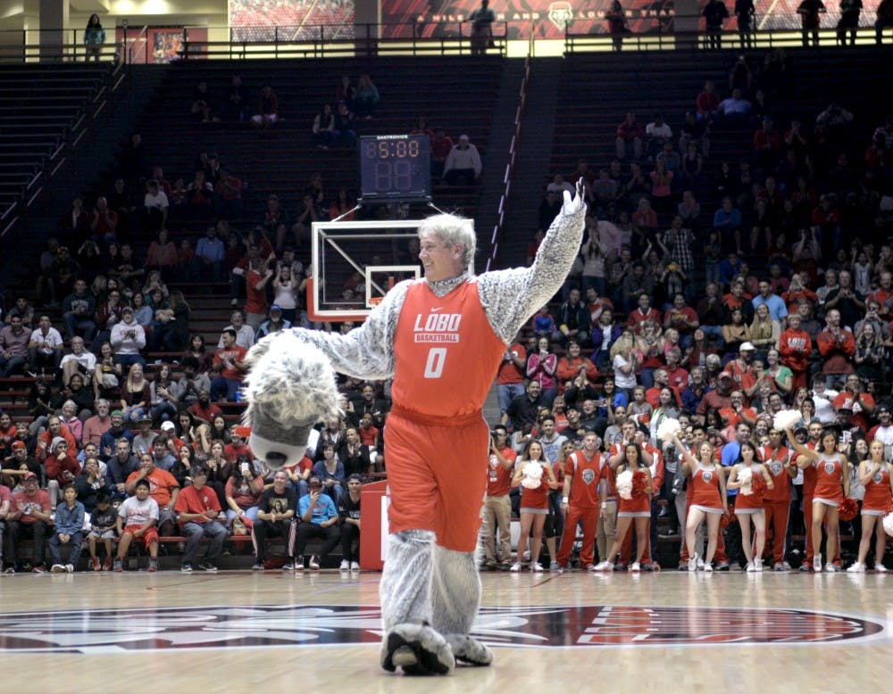 Head basketball coach Craig Neal unmasks himself at WisePies Arena Oct. 16, 2015. Neal unveiled himself after dancing to songs masked as Lobo Luie during the mens and womens Lobo Howl. 