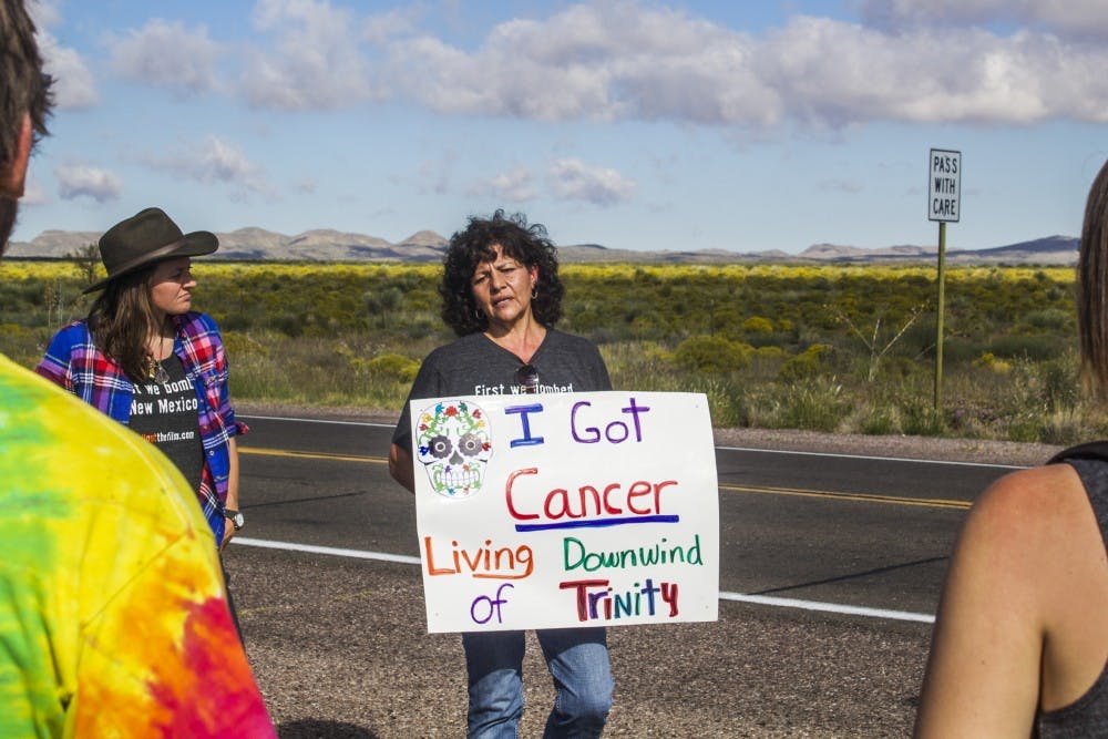 Tina Cordova,&nbsp;middle, talks to UNM students about being a Tularosa "downwinder" on Saturday, Oct. 1, 2016 at the Trinity Site. Eileen Shaughnessy, left, took&nbsp;her sustainability class, Nuclear New Mexico, to visit the historical site.