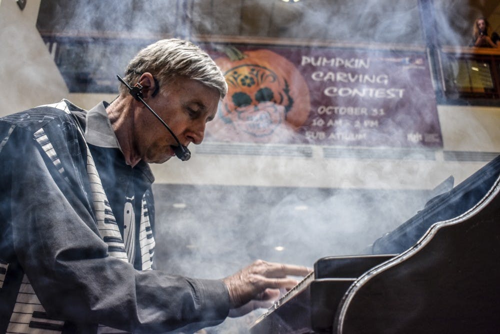 Kirk Garrett with Dueling Pianos Anywhere performs in the Student Union Building Atrium at the University of New Mexico on Tuesday, Oct. 20.