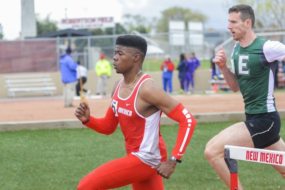 Senior Mustafa Mudada rounds the corner during a hurdles event at the Don Kirby Tailwind Invitational Saturday, April 1, 2017.&nbsp;