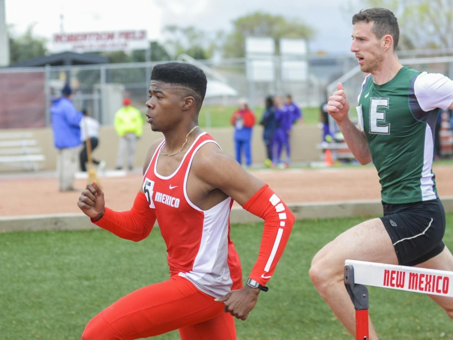 Senior Mustafa Mudada rounds the corner during a hurdles event at the Don Kirby Tailwind Invitational Saturday, April 1, 2017. 