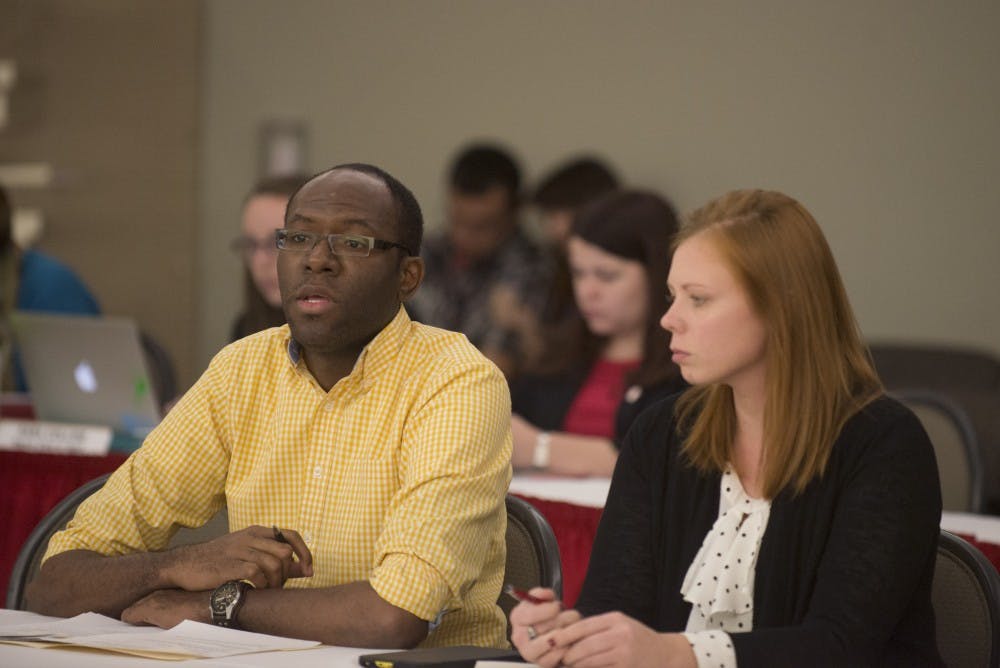 Sen. Representative Udell Calzadillas Chavez, right and Stephanie Everett discuss a resolution that would support UNM removing Columbus Day from UNM Calendars on Wednesdays ASUNM meeting in the SUB. KIVA Club criticized ASUNM for being ignorant about the issue.  