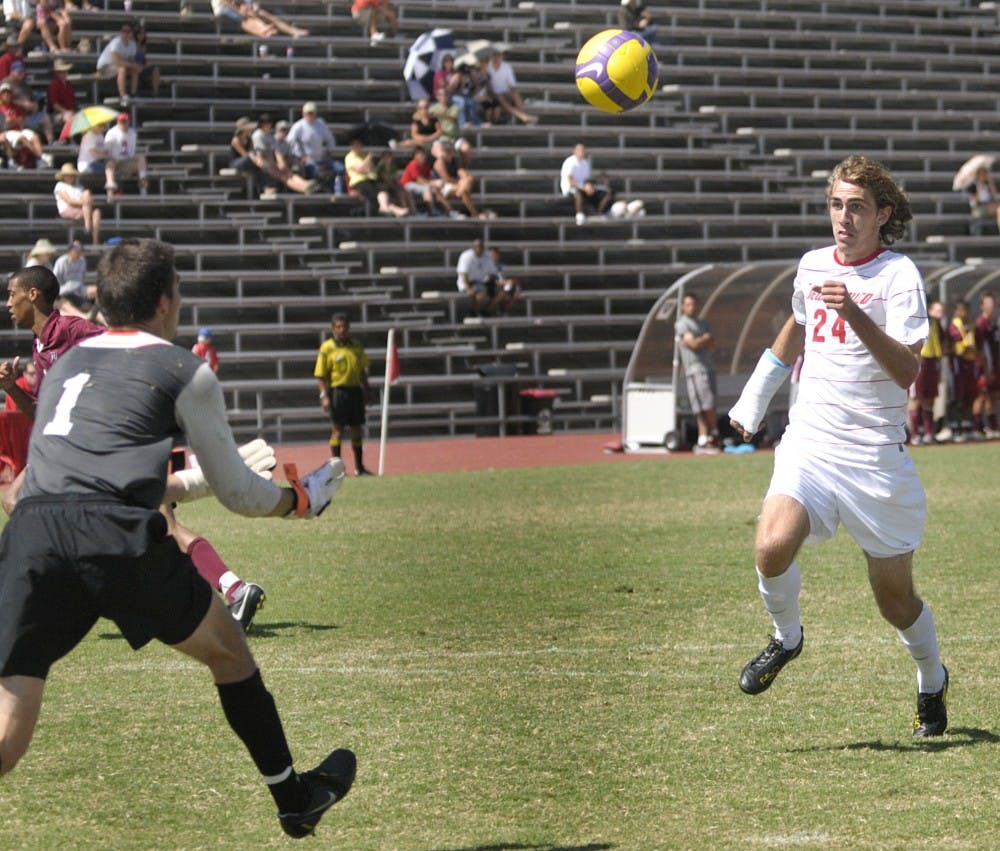 	UNM forward Josh Caffey pursues a 50-50 ball during the Lobos’ match Sunday against Harvard at the UNM Soccer Complex. The Lobos tied the match with the Crimson, 0-0. 