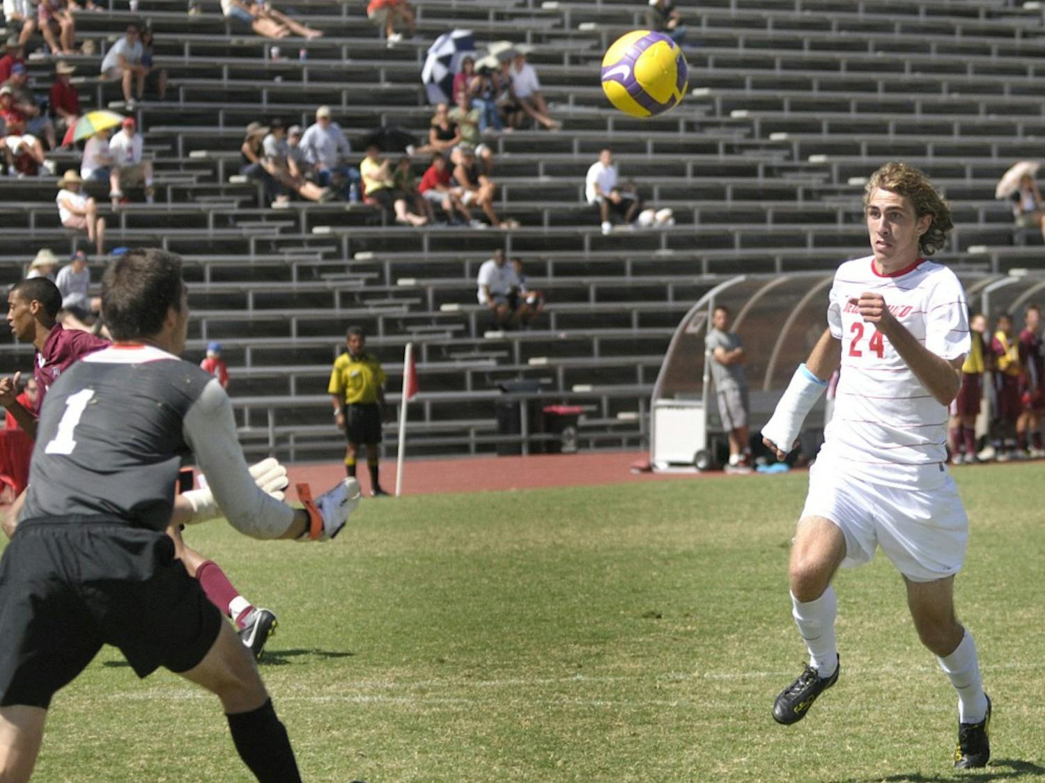 	UNM forward Josh Caffey pursues a 50-50 ball during the Lobos’ match Sunday against Harvard at the UNM Soccer Complex. The Lobos tied the match with the Crimson, 0-0. 