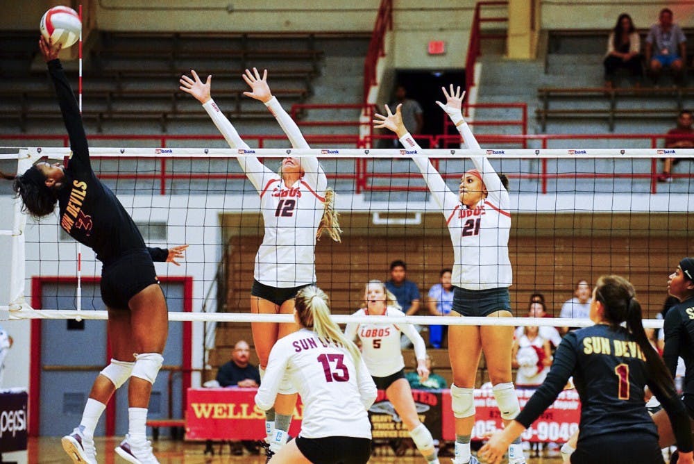 Arizona State's Maya McClendon (3) attempts a kill against UNM's Cassie House (12)&nbsp; and Mariessa Carrasco (21) on Friday, August 26, 2016 at Johnson Center. The Lobos played their first day in the UFS Tournament on Friday, splitting a doubleheader.&nbsp;