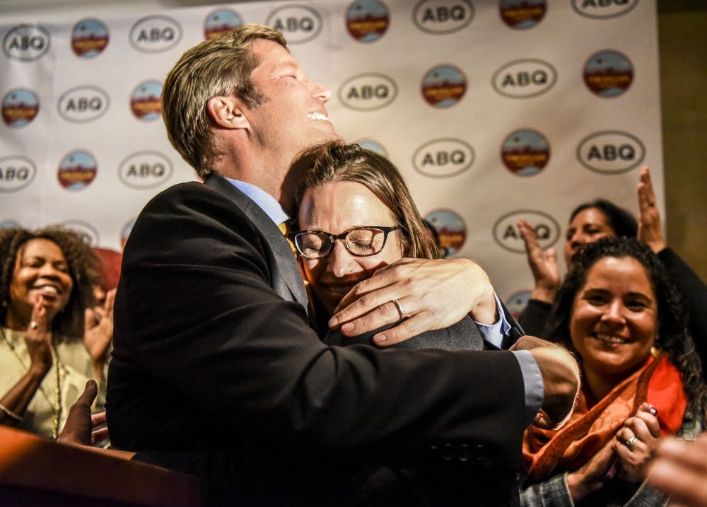 Mayoral Elect Timothy "Tim" Keller embraces his wife after delivering a victory speech to a crowd of supporters at Hotel Andaluz on Nov. 14, 2017. Shortly after opponent Daniel "Dan" Lewis announced his concession.&nbsp;
