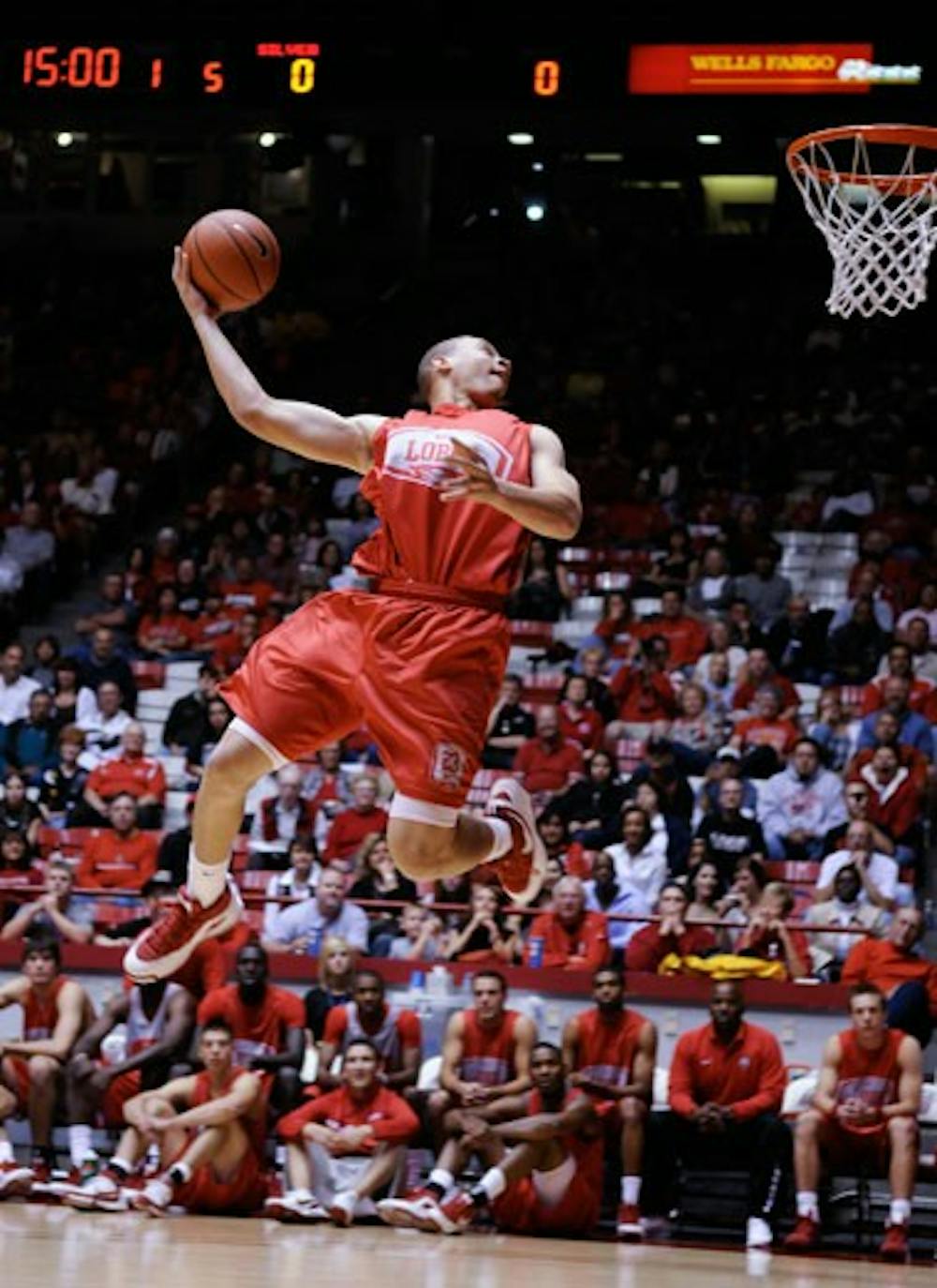Lobo freshman Phillip McDonald soars toward the basket during the dunk competition at Friday's Lobo Howl at The Pit. Tony Danridge won the event. 