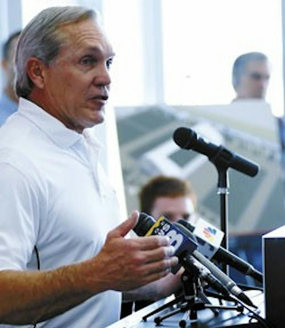 Rocky Long, head coach of the UNM football team, speaks at a press conference in the Tow Diehm Athletic Center about the future benefits of an indoor practice facility before a groundbreaking ceremony Wednesday. 