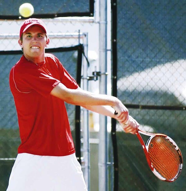 Tennis player Graeme Kassautzki hits a forehand during a match against Northern Arizona on March 17. 