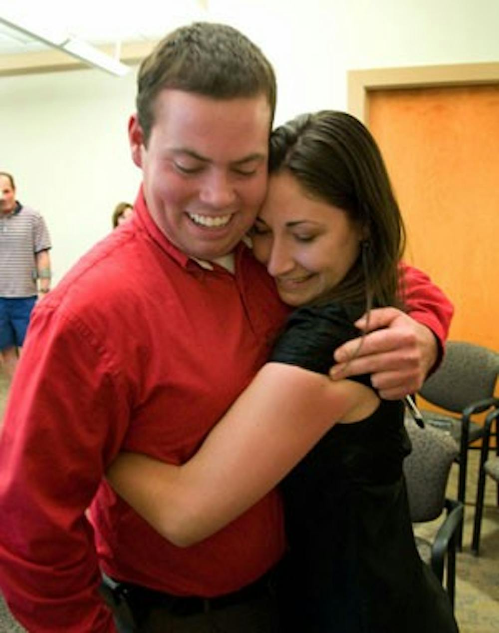 Alex Riebli and Ashley Fate celebrate their victories in the ASUNM election Wednesday. Fate was re-elected president and Riebli was elected vice president.