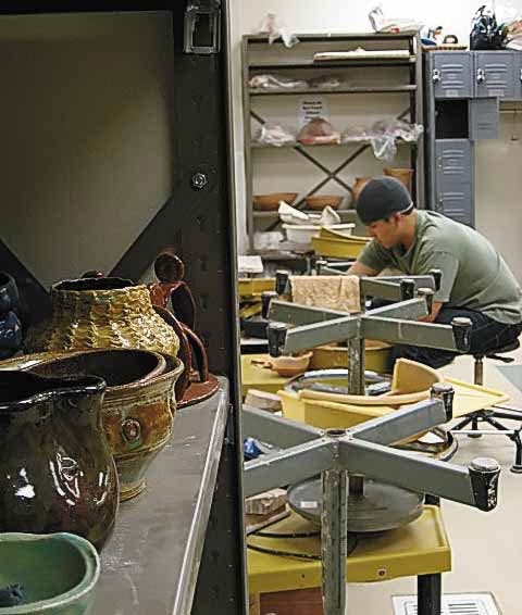 Student Justin Moya throws a bowl on a potter's wheel in the ASUNM Arts and Crafts Studio in the SUB on Thursday.