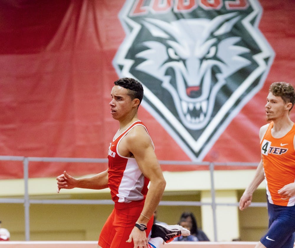 A Lobo sprinter runs through the curve of the track at the Albuquerque Convention Center Saturday, Feb. 4, 2017.&nbsp;