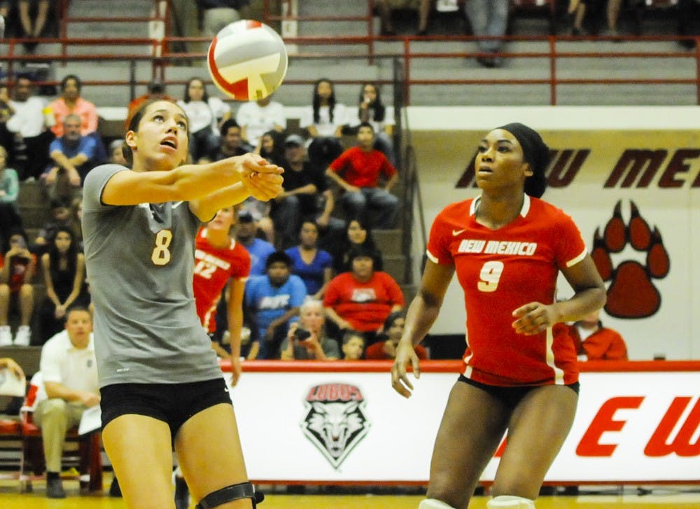 Lobo redshirt freshman outside hitter Ashley Kelsey keeps the ball in play, while junior middle blocker Simone Henderson looks on during the game against UC Irvine at Johnson Gym on Sept. 13. The Lobos will play Nevada Saturday afternoon in Reno, Nevada.