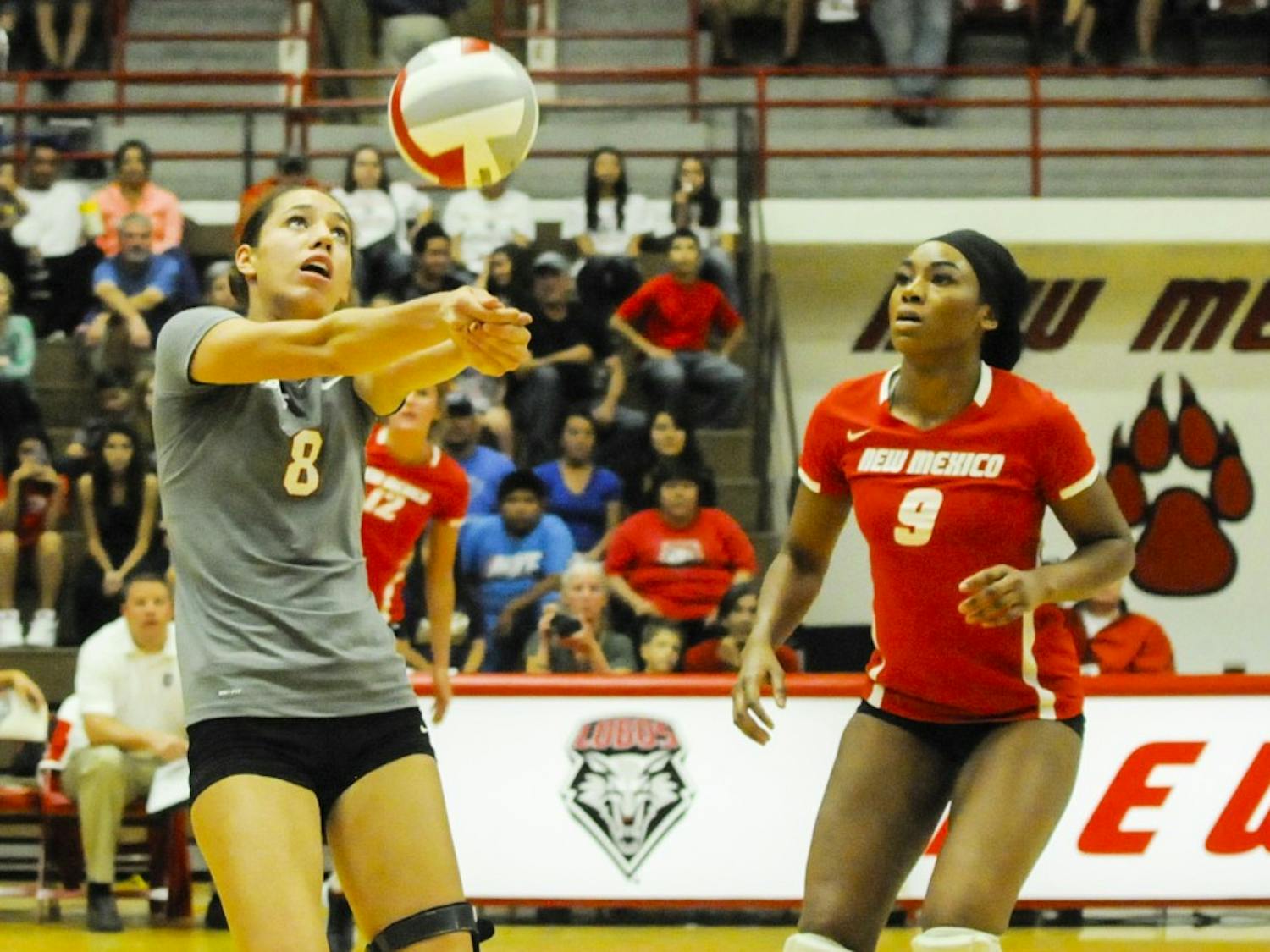 Lobo redshirt freshman outside hitter Ashley Kelsey keeps the ball in play, while junior middle blocker Simone Henderson looks on during the game against UC Irvine at Johnson Gym on Sept. 13. The Lobos will play Nevada Saturday afternoon in Reno, Nevada.