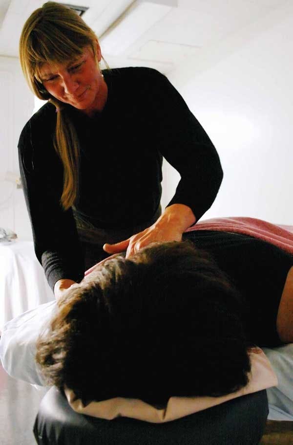 Massage therapist Patricia Ames gives Shirlee James-Johnson a Swedish massage on Tuesday in the Student Health Center. The Lobo Care Clinic moved in July to the Student Health Center. 