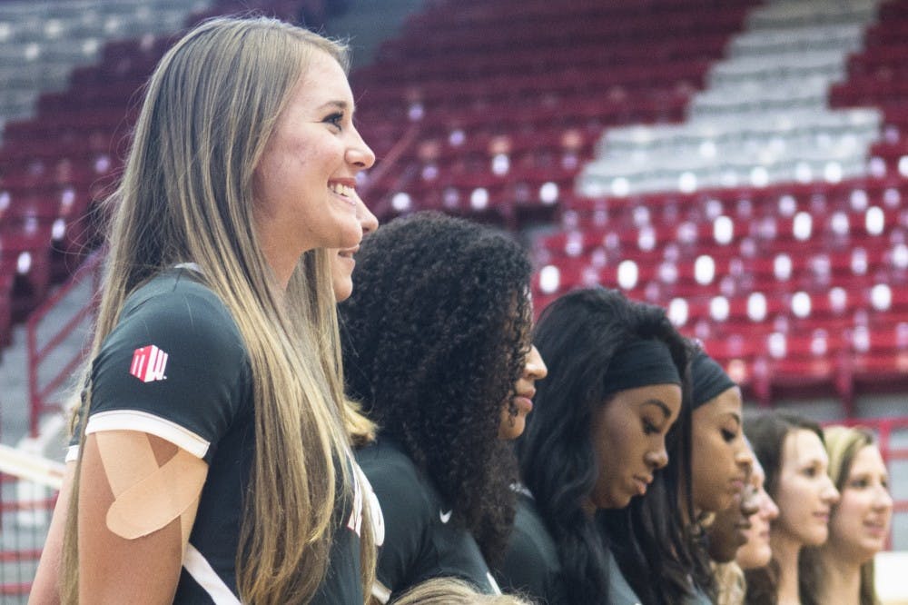 	New Mexico volleyball outside hitter Cassie House (left) poses for a team photo with her teammates at Johnson Gym on Aug. 11. House played for the US A2 National Team and the Mountain West All-Star team this summer.