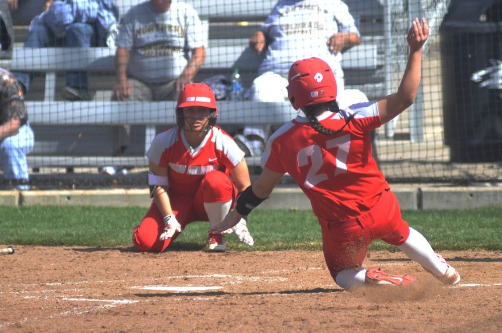 Freshman outfielder Brooke Breeland (27) slides into home plate Saturday afternoon at the Lobo Softball Field. The Lobos swept Northern Colorado this past weekend out of three game series.