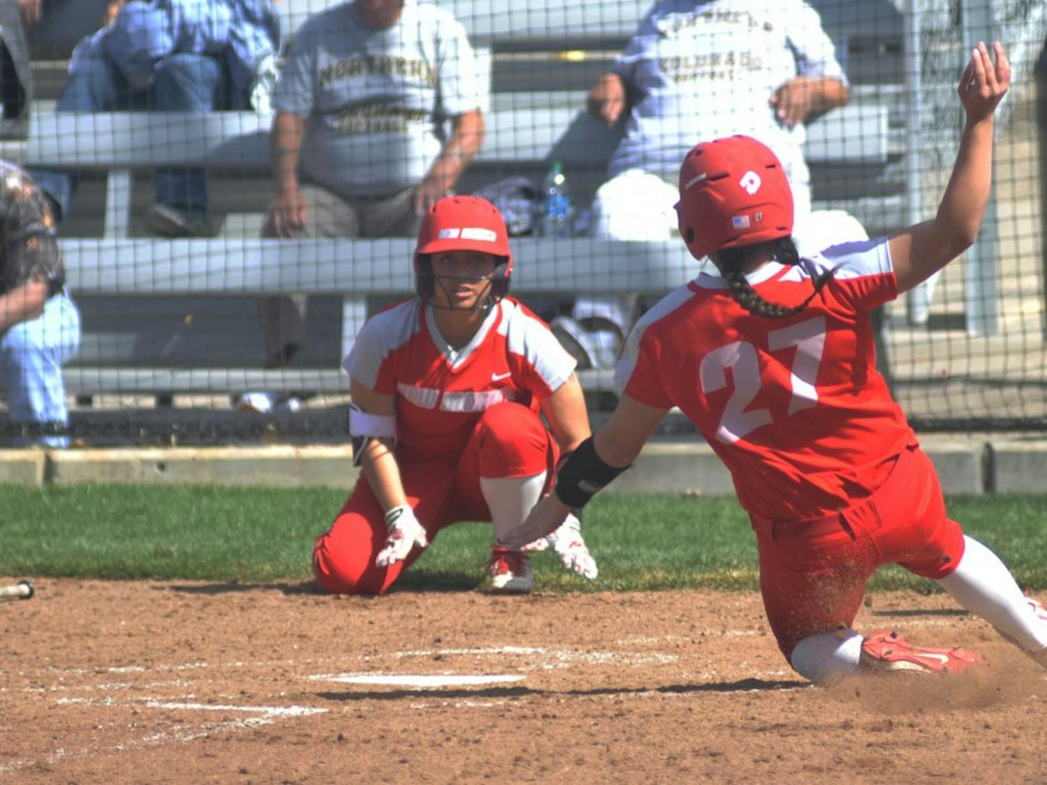 Freshman outfielder Brooke Breeland (27) slides into home plate Saturday afternoon at the Lobo Softball Field. The Lobos swept Northern Colorado this past weekend out of three game series.