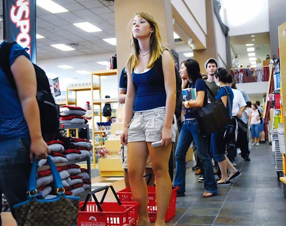 Sophomore Jacquelyn Gonzales waits in line before checking out at the UNM Bookstore on Monday.  